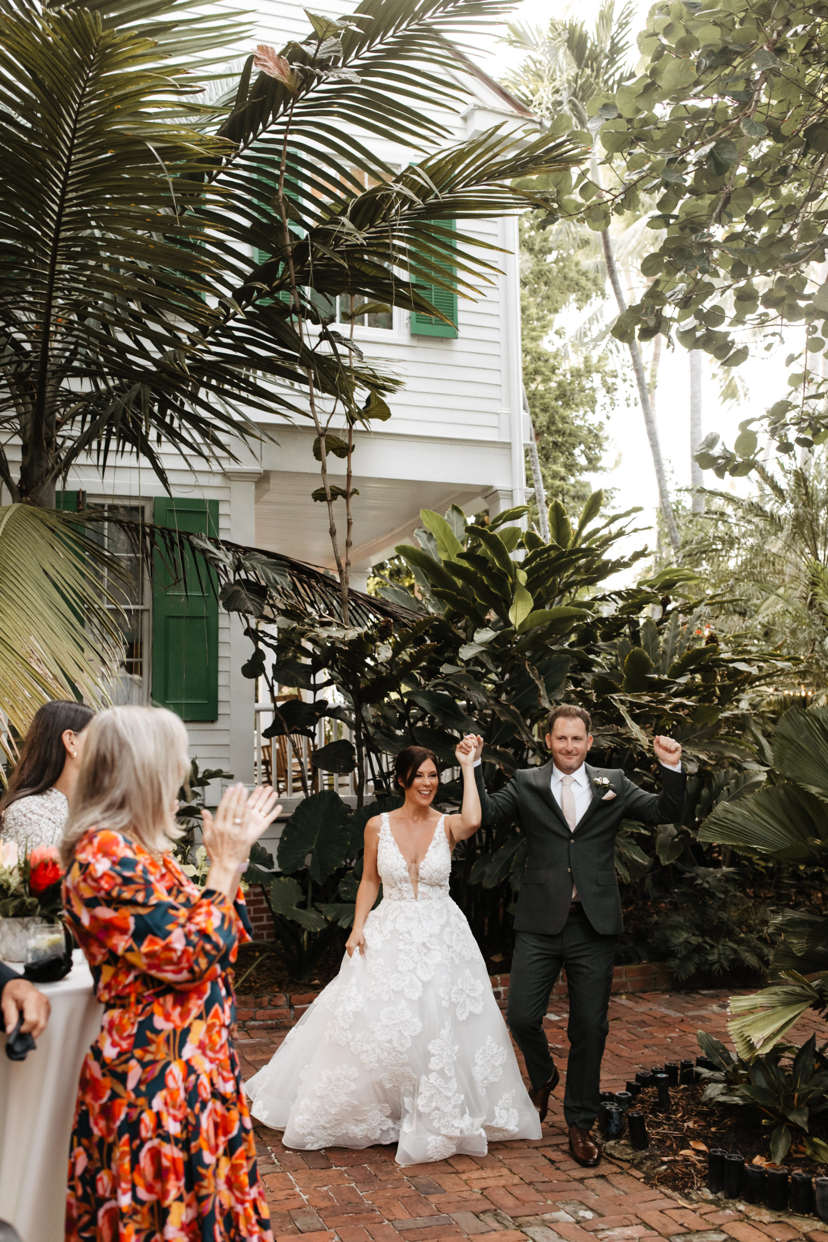 bride and groom entering the reception captured by the Key West photographer