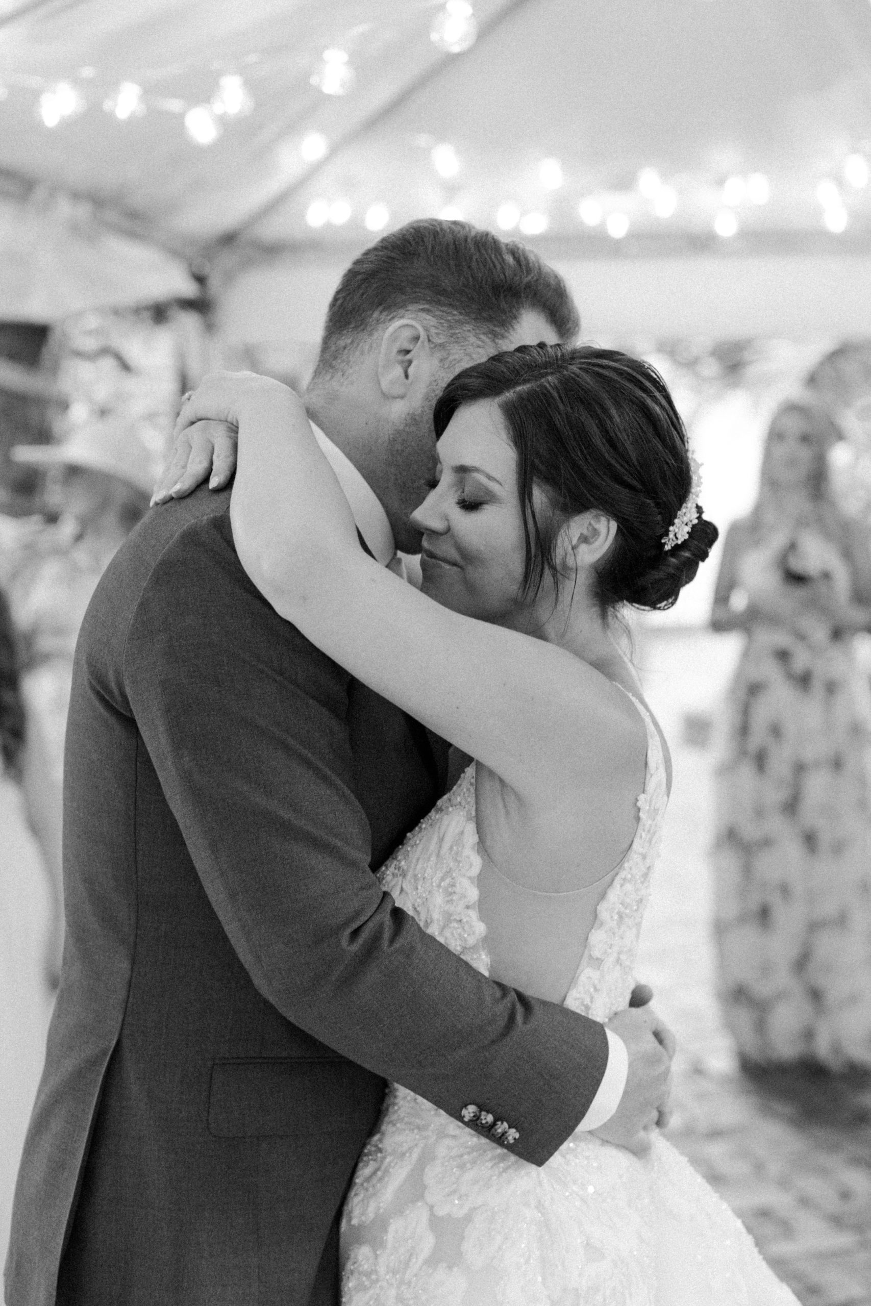 the Key West photographer captures the groom and bride hold each other during their first dance
