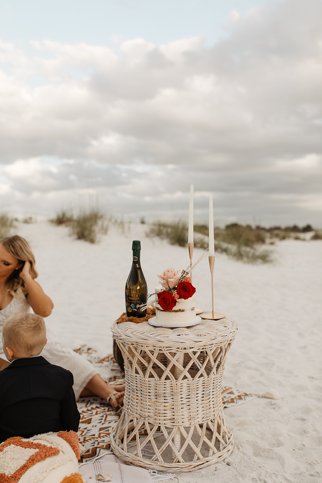 the boho picnic decorations at the beach elopement