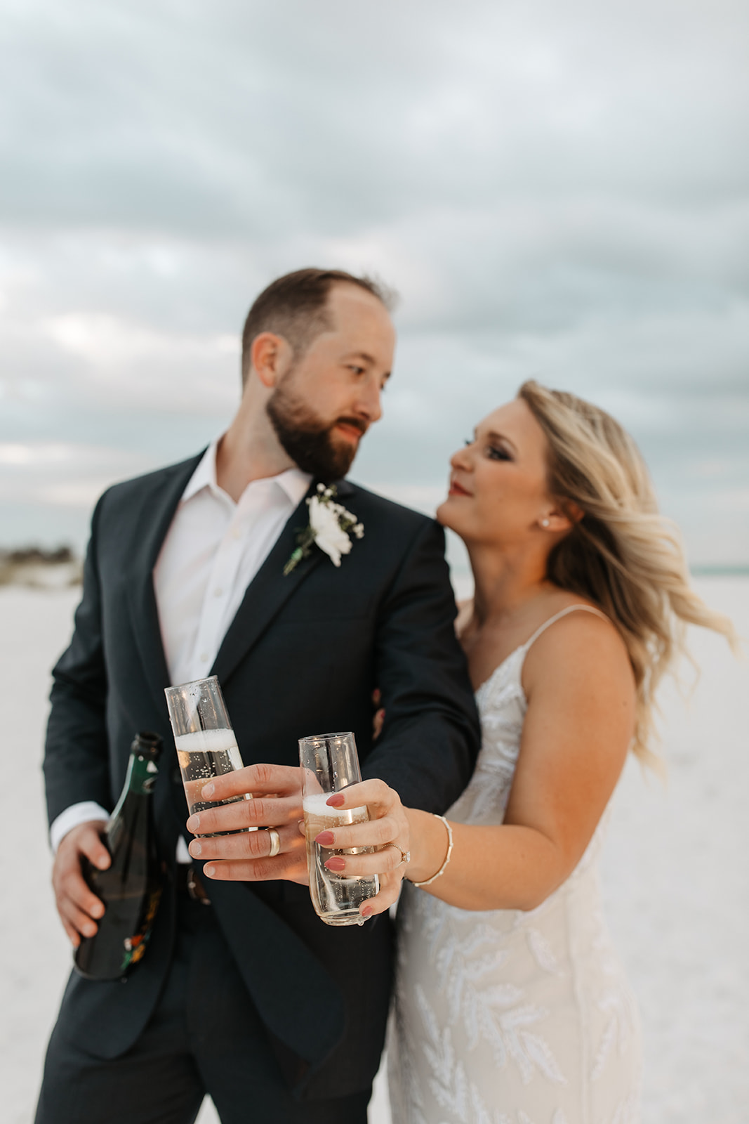 the couple celebrates their elopement with champagne