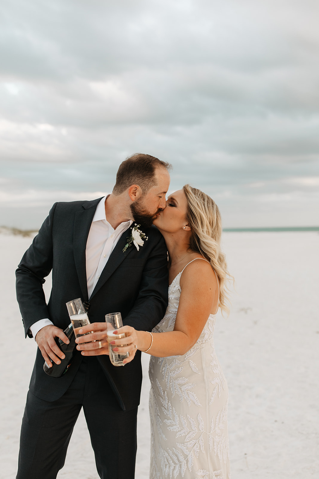 the bride and groom kiss at Anna Maria Island to celebrate their marriage
