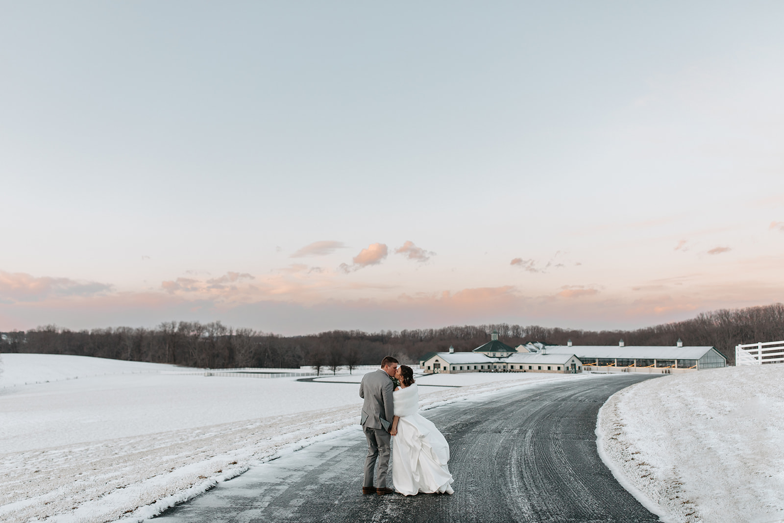 the couple kissing outside in the snow at Vignon Manor Farm