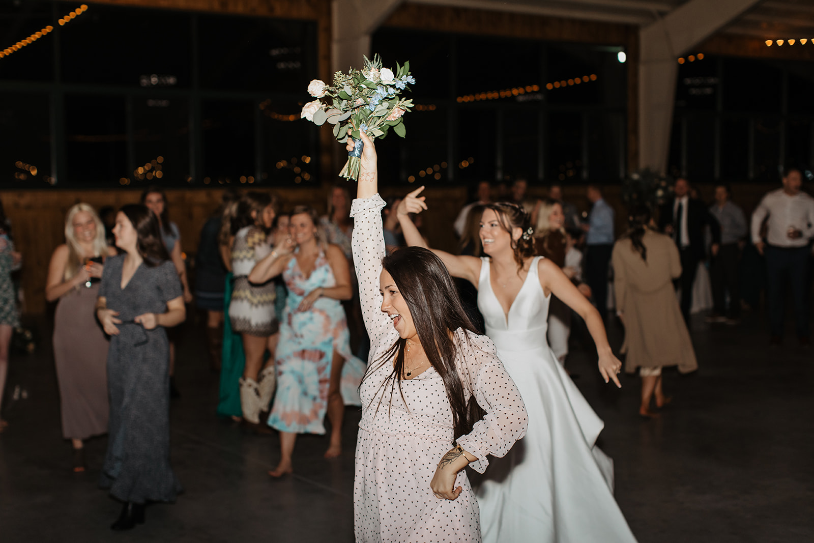 the bouquet toss at the wedding