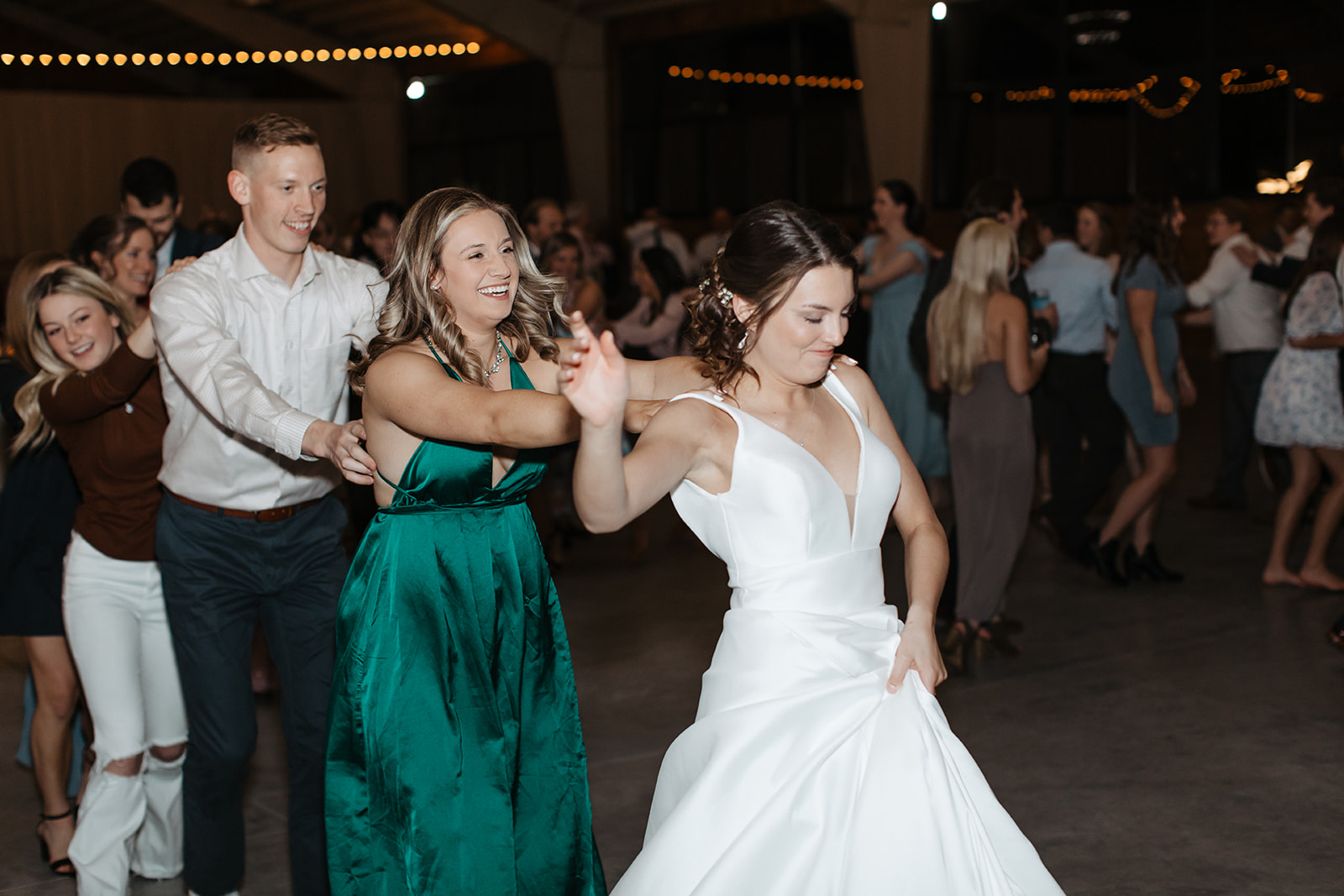 the bride leading a dance train