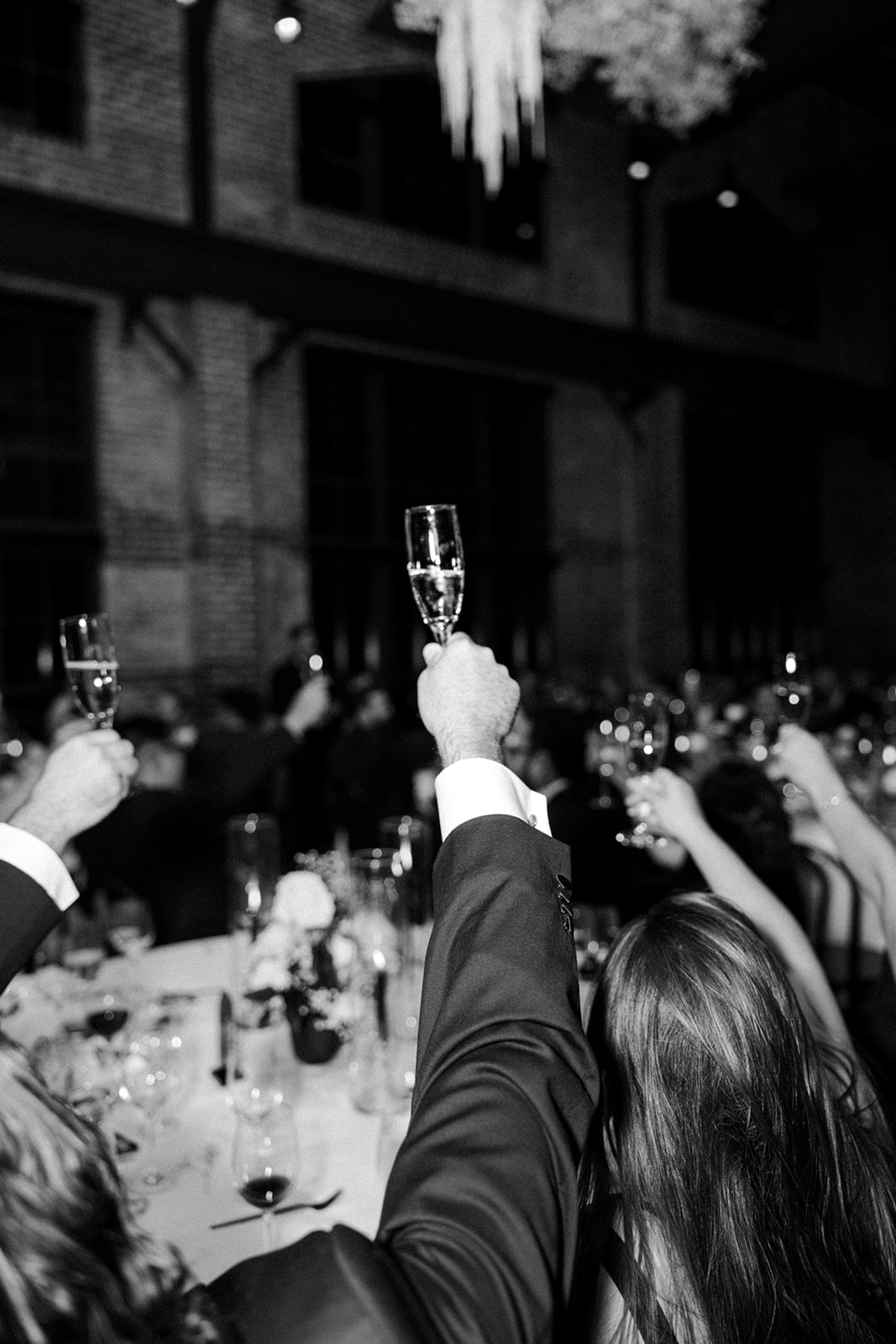 the people toasting at the wedding captured by the wedding photographer in Washington DC