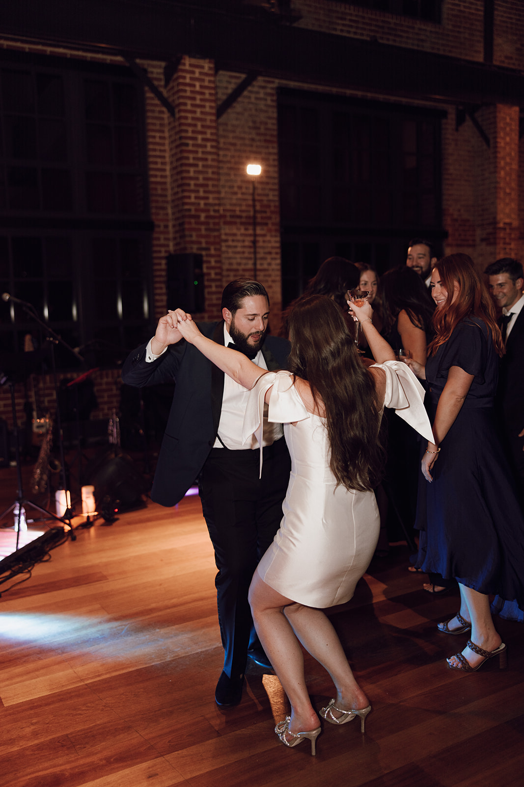 the bride and groom dancing on the dance floor captured by the wedding photographer in Washington DC