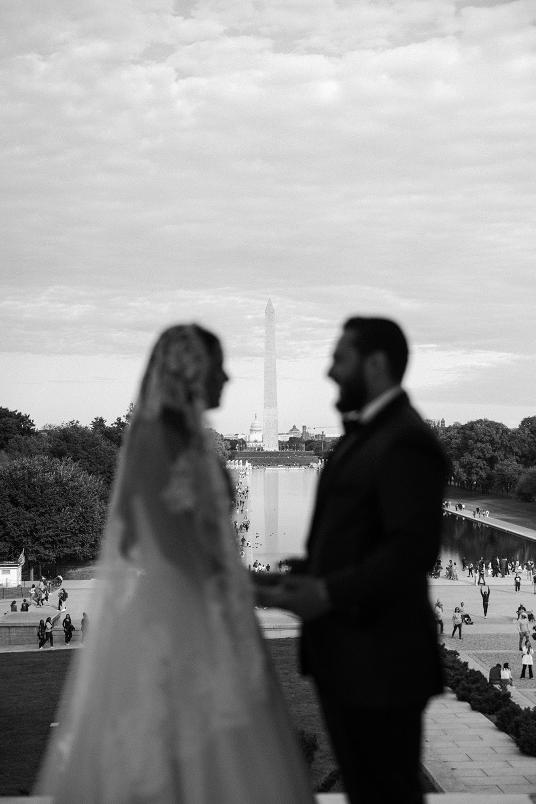 the couple with the Washington Monument behind them
