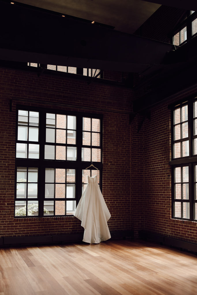 the wedding dress hanging in the venue