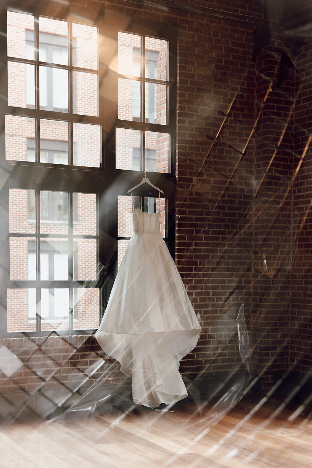 the wedding dress hanging up at the wedding venue for the wedding photographer in Washington DC