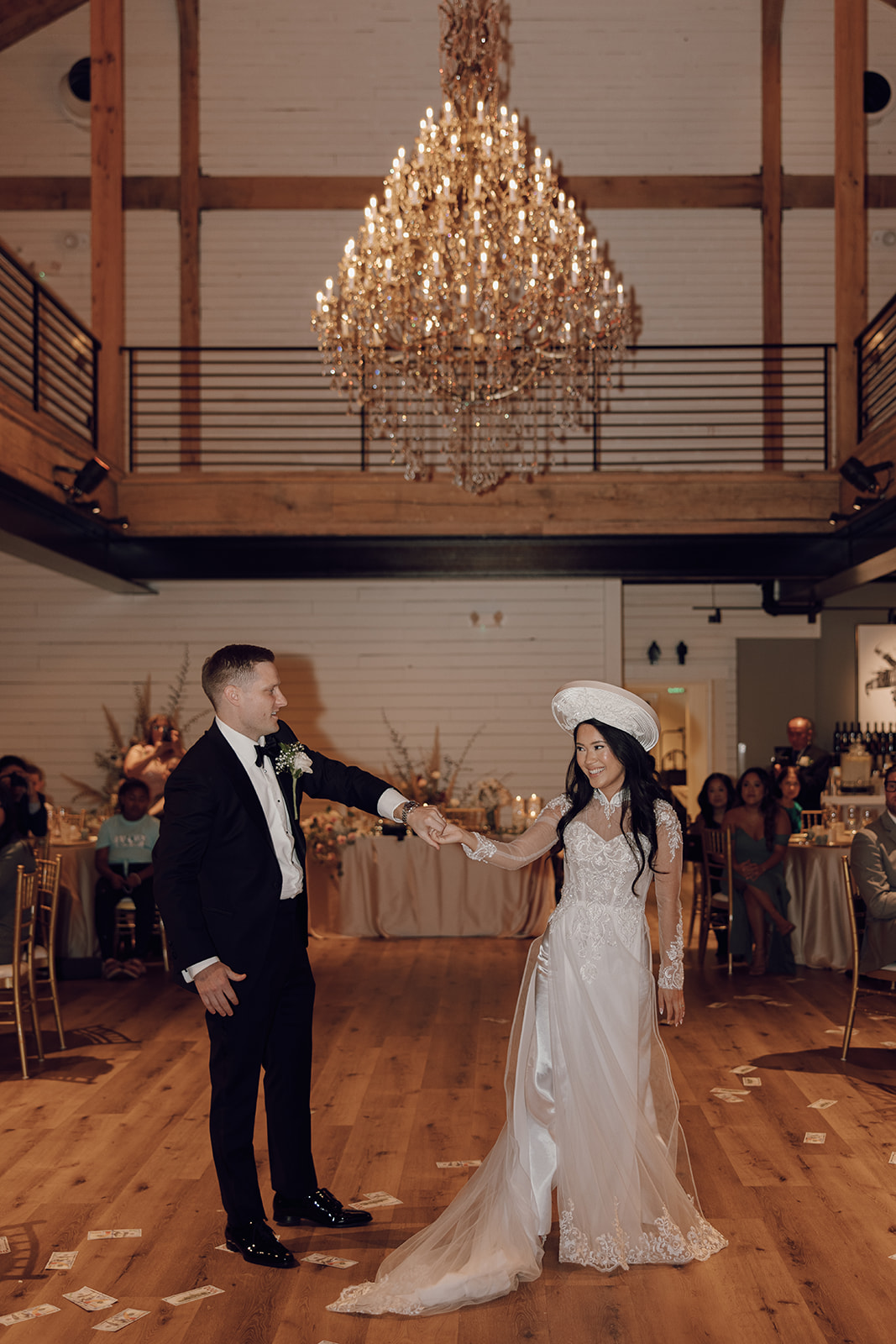 the couple dancing under the chandelier captured by the destination wedding photographer
