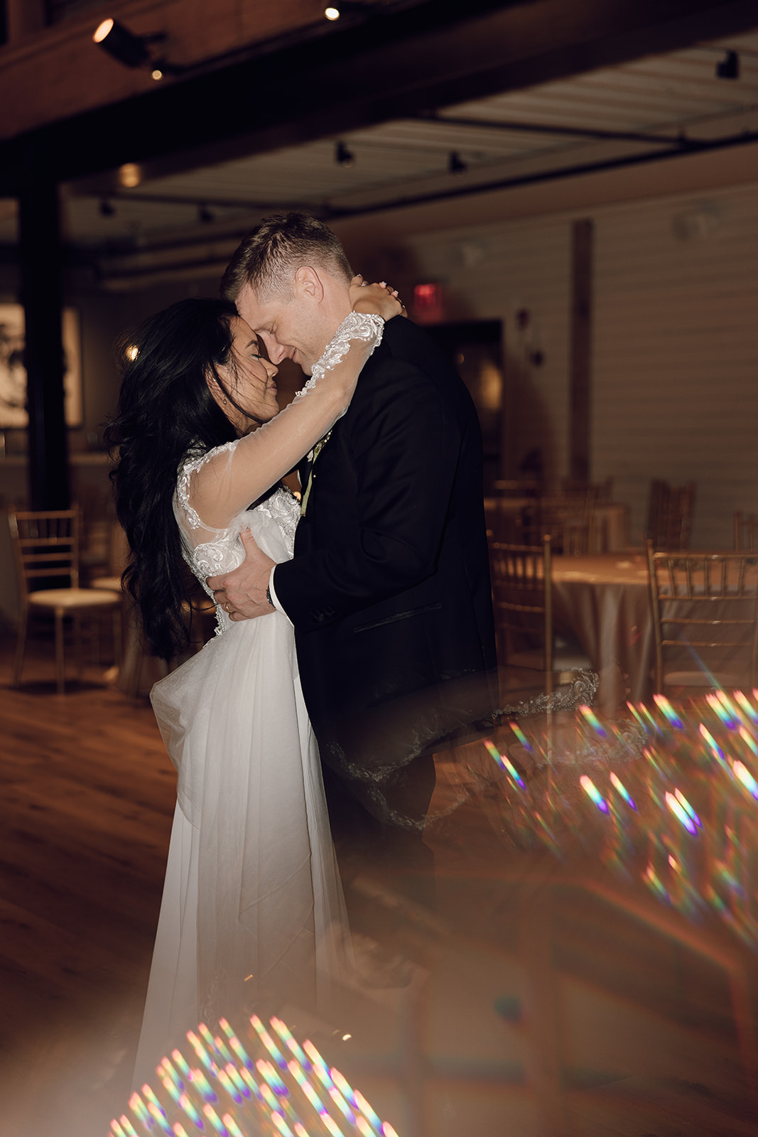 the couple dancing with their arms around each other captured by the destination wedding photographer