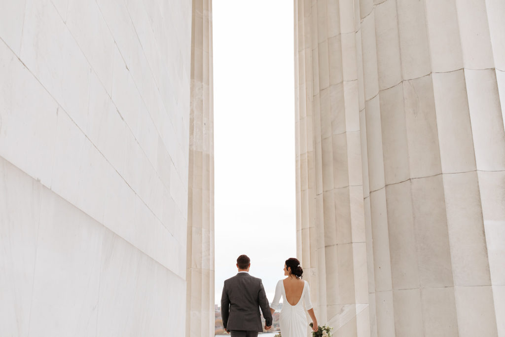 the couple walking away from their destination wedding photographer