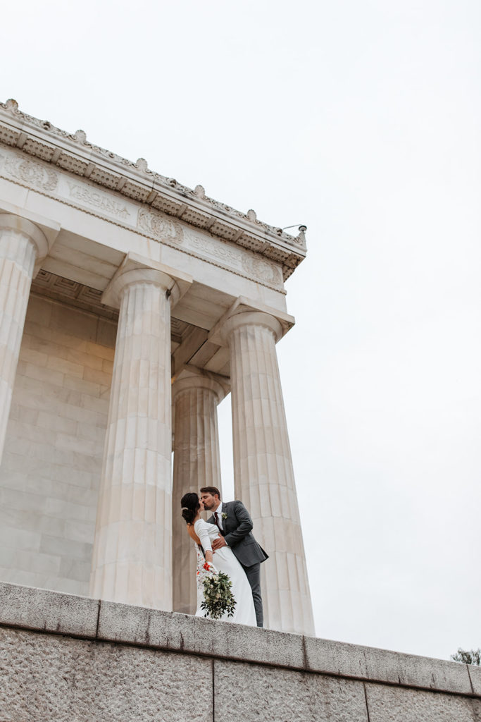 the couple kissing at the Lincoln Memorial for destination wedding photos