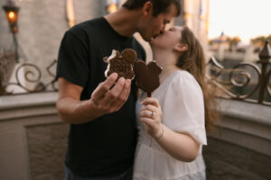 the couple kissing with their ice cream