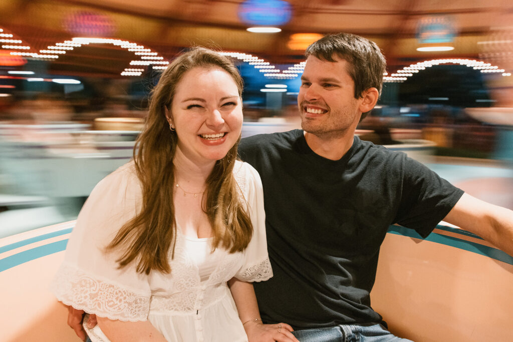 the couple laughing with one another on the Magic Kingdom Ride