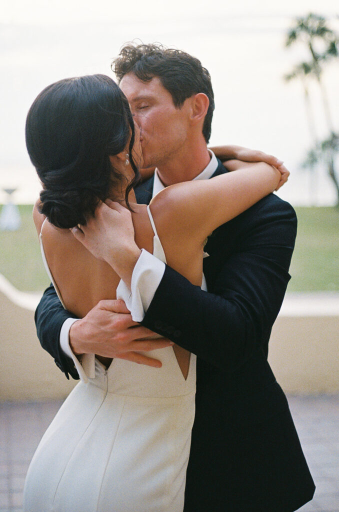 the bride and groom kissing film photography