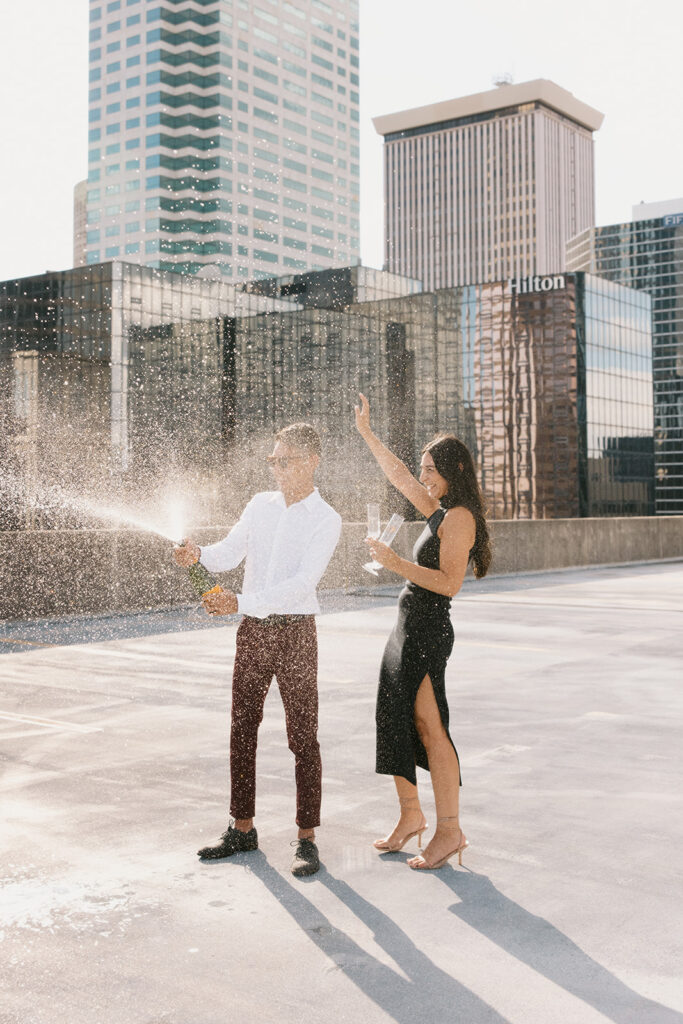 champagne popping engagement pictures in Tampa