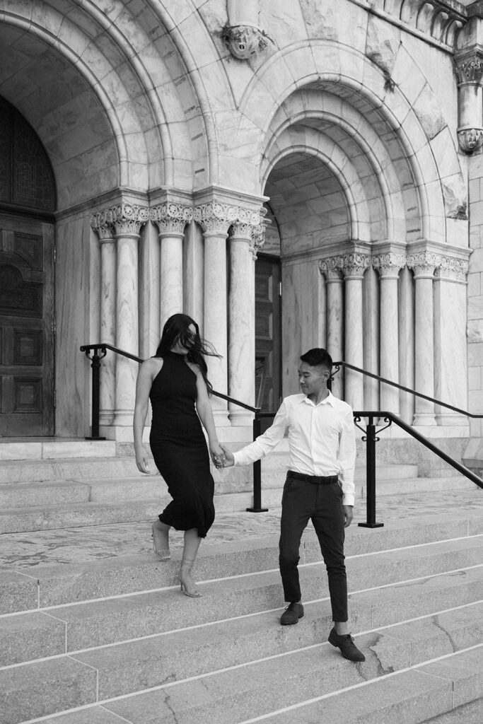 the engaged couple walking down the stairs in downtown Tampa
