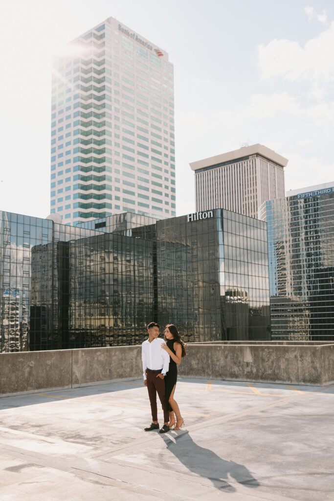 the engaged couple taking engagement photos in Tampa