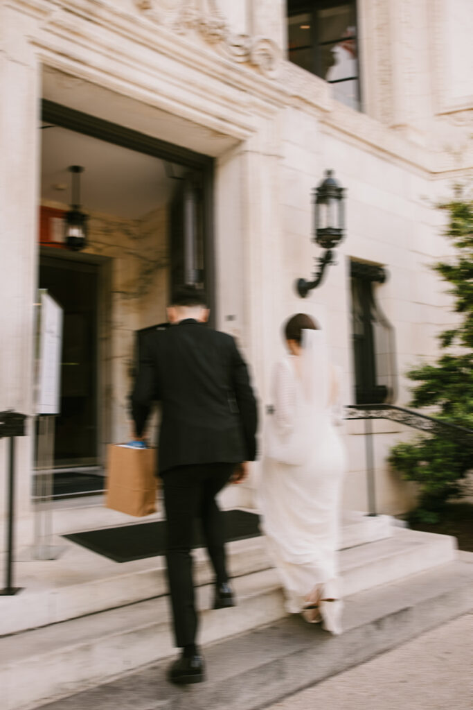 the bride and groom walking into the church