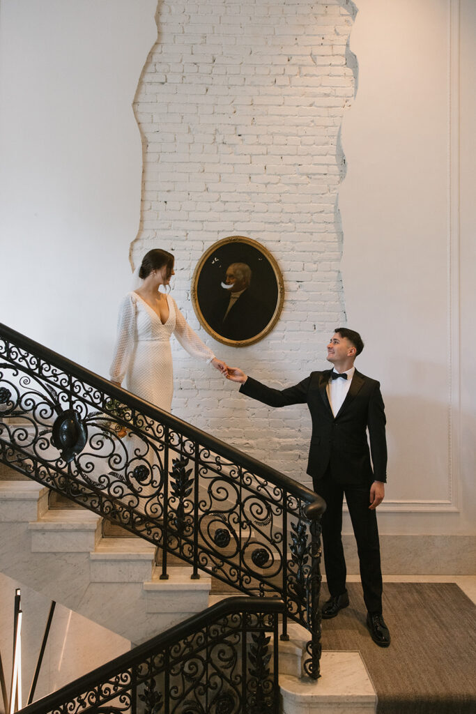 the bride and groom on the stairs for creative wedding photos