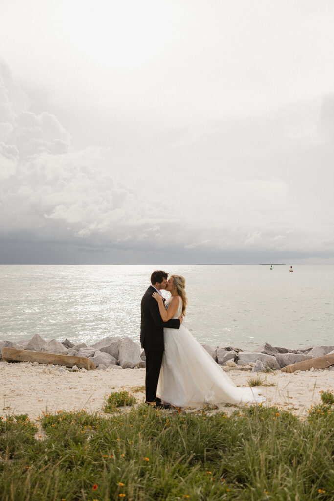 the bride and groom kissing during their elopement ceremony in Florida
