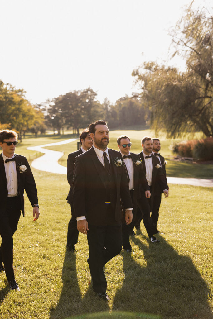 the groom and groomsmen walking